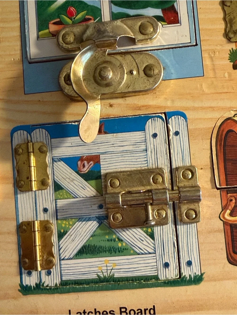 Melissa & Doug Wooden Latches Board - Red, Blue, Yellow, Green, Brown